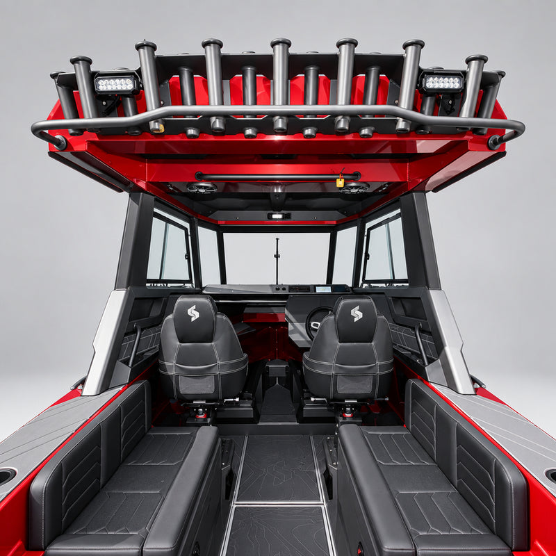 A red and black Stabicraft boat with a dual captain's seat, rear swim platform, and a large rear-mounted wakeboard tower, photographed in a boat dealership setting.