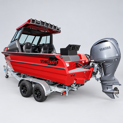 A red and gray Stabcraft motorboat on a dual-axle trailer, equipped with a gray Yamaha outboard motor, photographed in an outdoor dealership setting.