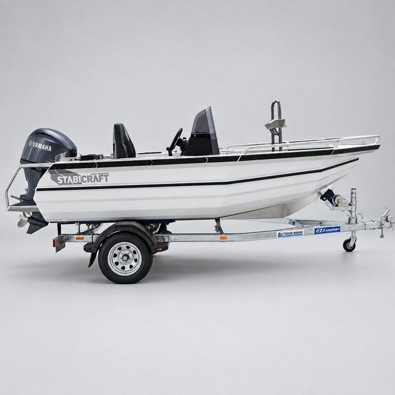 A white Starcraft boat on a trailer parked outdoors in front of a Yamaha dealership building.
