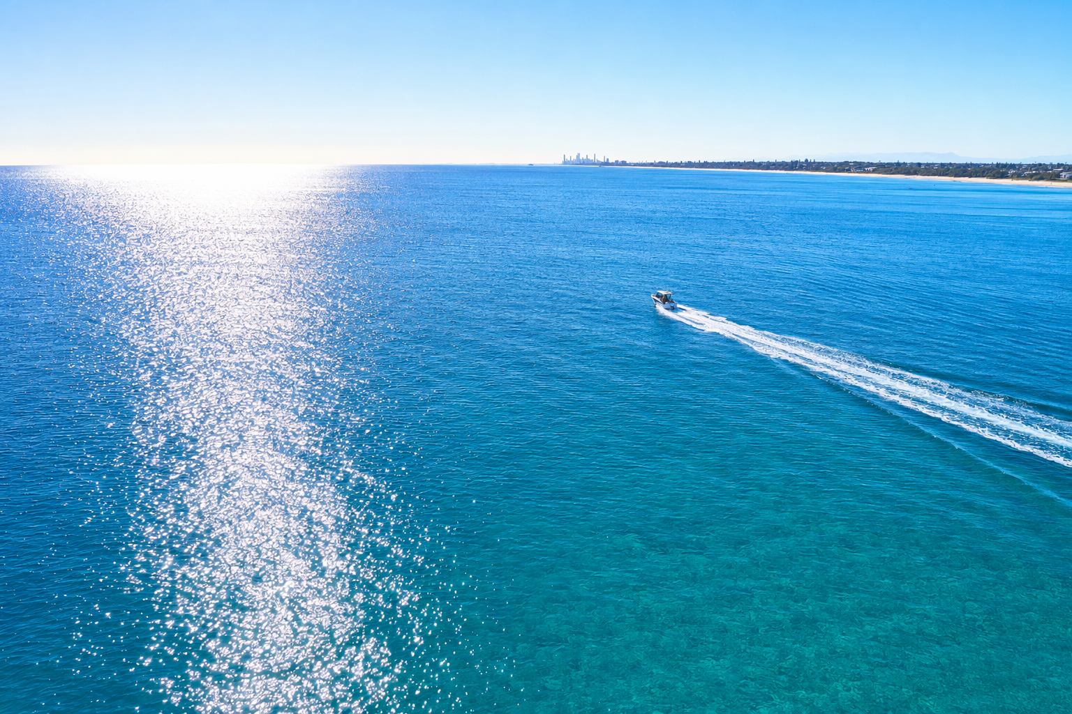 Boating on sparkling blue water on a sunny Queensland day